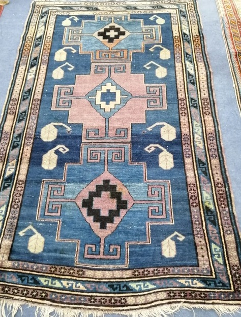 A blue ground rug 120 x 185cm